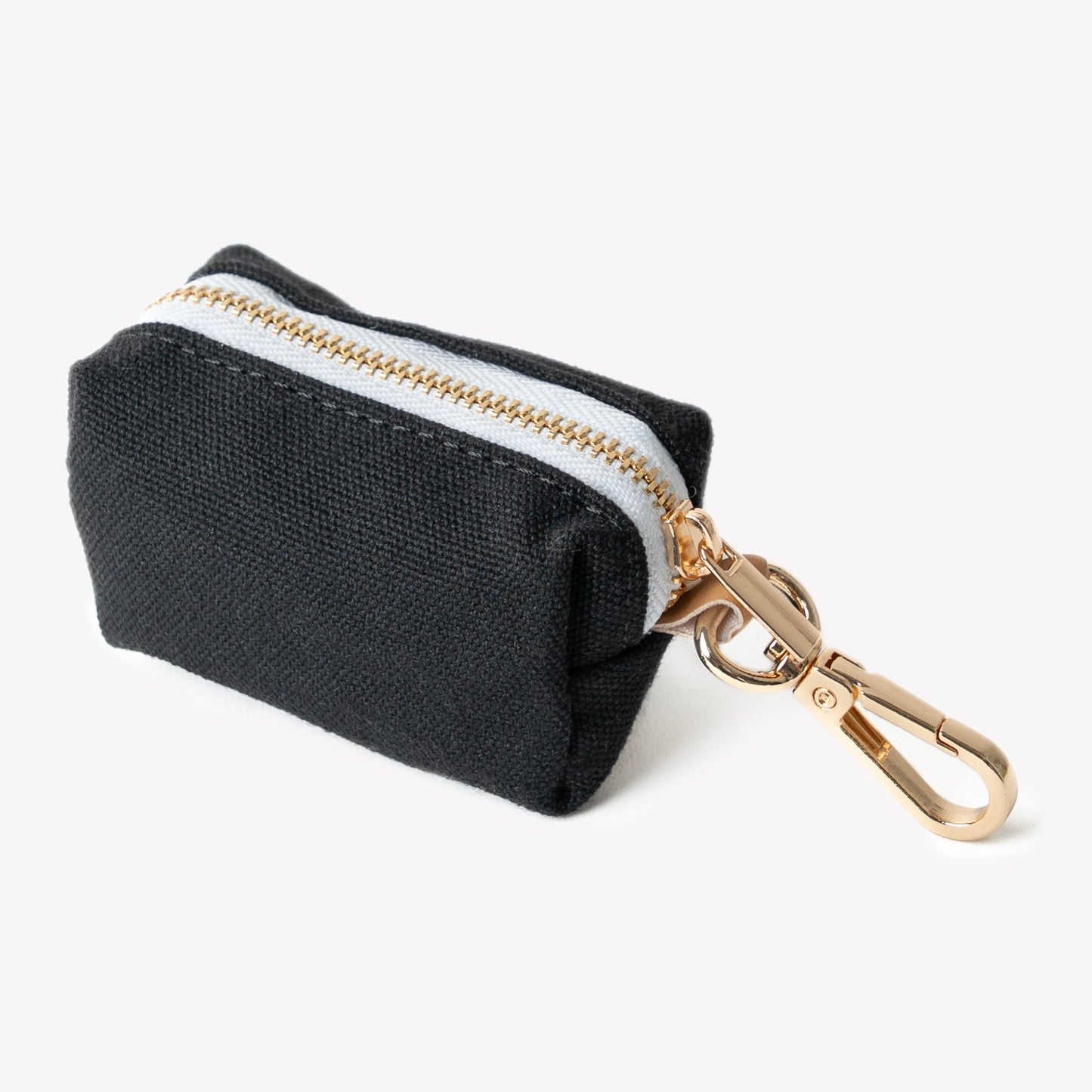 Black pouch with gold zipper and keychain clip on a white background