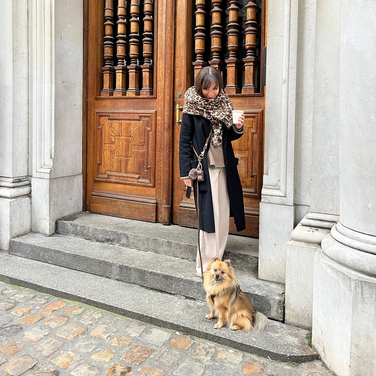 Person with a dog in a FURLOU hands-free leash lifestyle setting