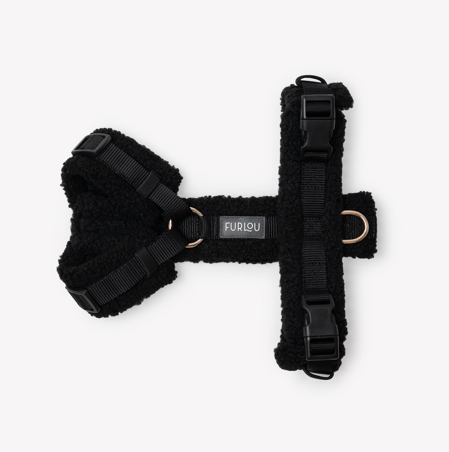 Black dog harness with Furlou label on a white background