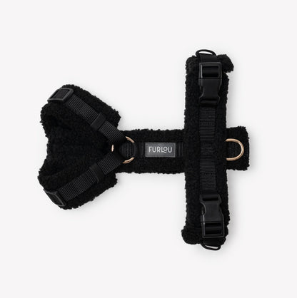 Black dog harness with Furlou label on a white background