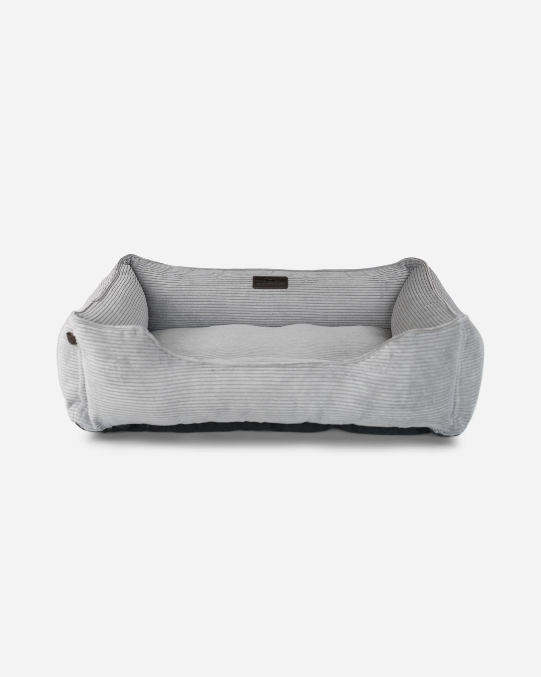 Gray pet bed with a ribbed texture on a white background