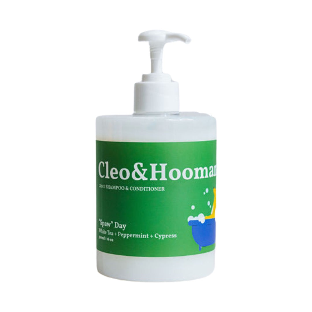 Bottle of Cleo & Hooman shampoo and conditioner with a green label on a white background
