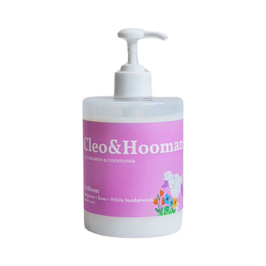 Bottle of Cleo & Hooman pet shampoo and conditioner with a pump on a white background