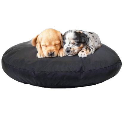Two puppies resting on a black Round Armor Dog Bed