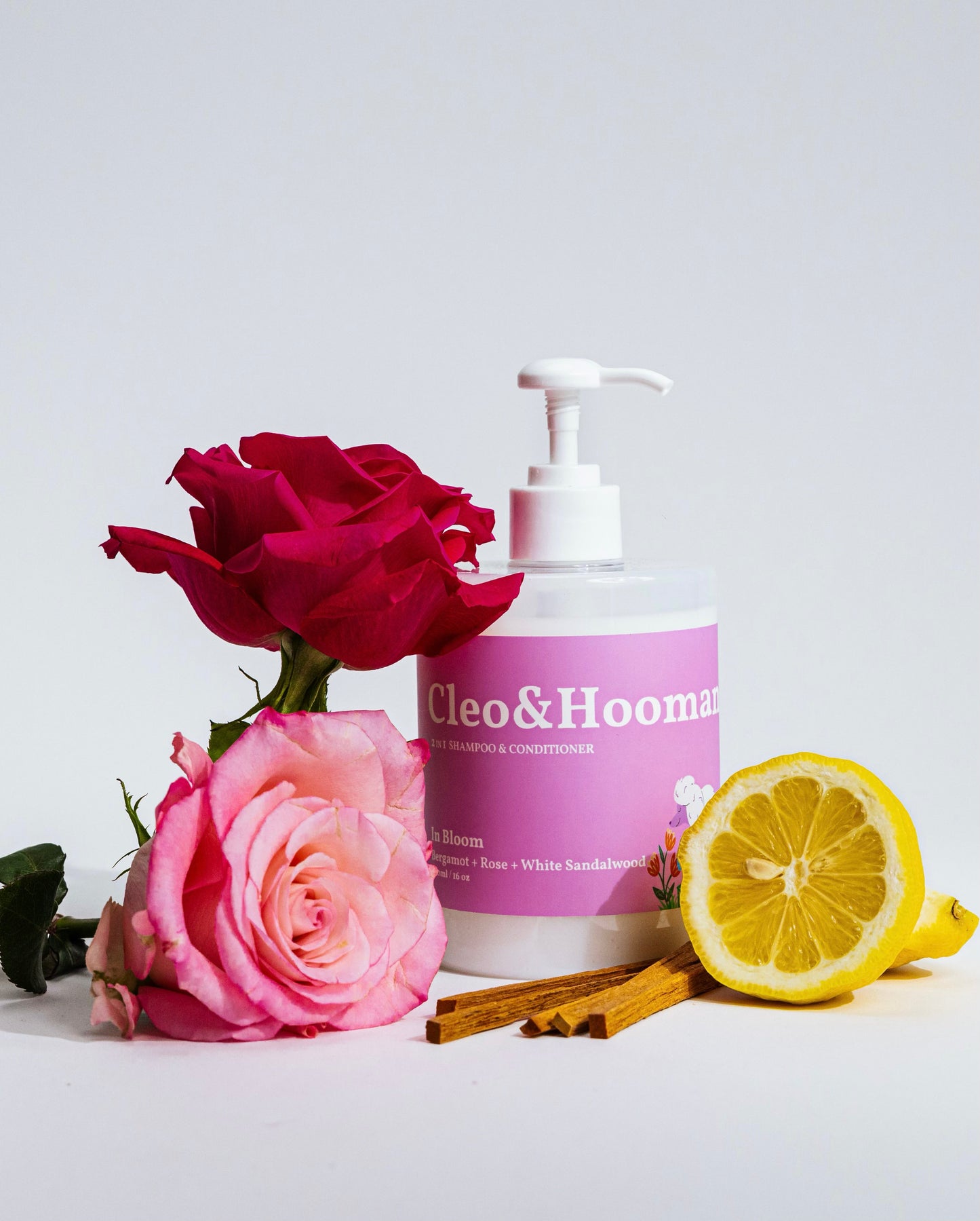 Cleo & Hooman product with roses and lemon on a light background