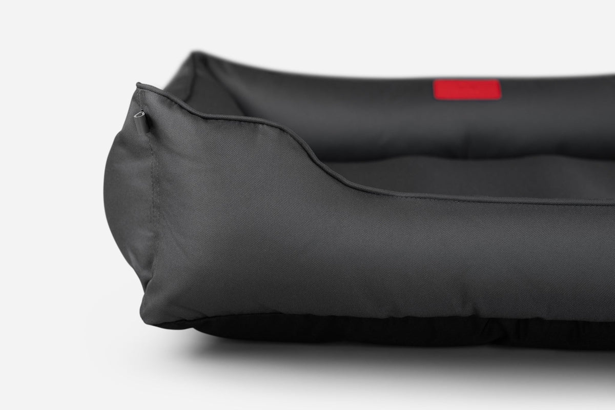 Side profile of the black Waterproof Sleeper Dog Bed