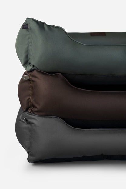 Waterproof Sleeper Dog Beds stacked in green, brown and black