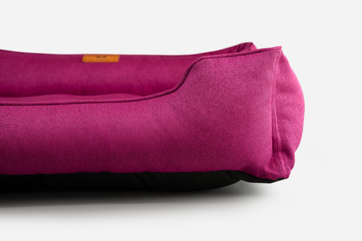 Cotton Sleeper Dog Bed - Berry Pink in use