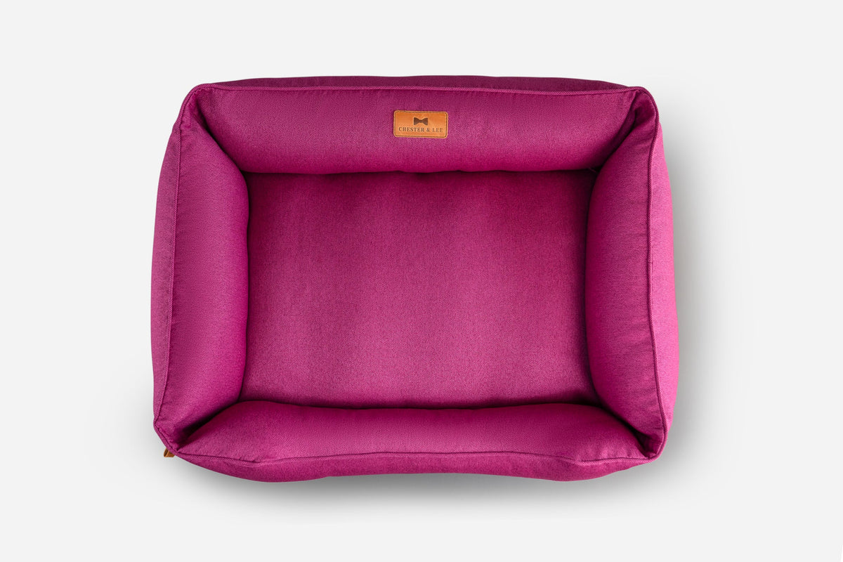 Cotton Sleeper Dog Bed - Berry Pink in use