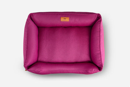 Cotton Sleeper Dog Bed - Berry Pink in use