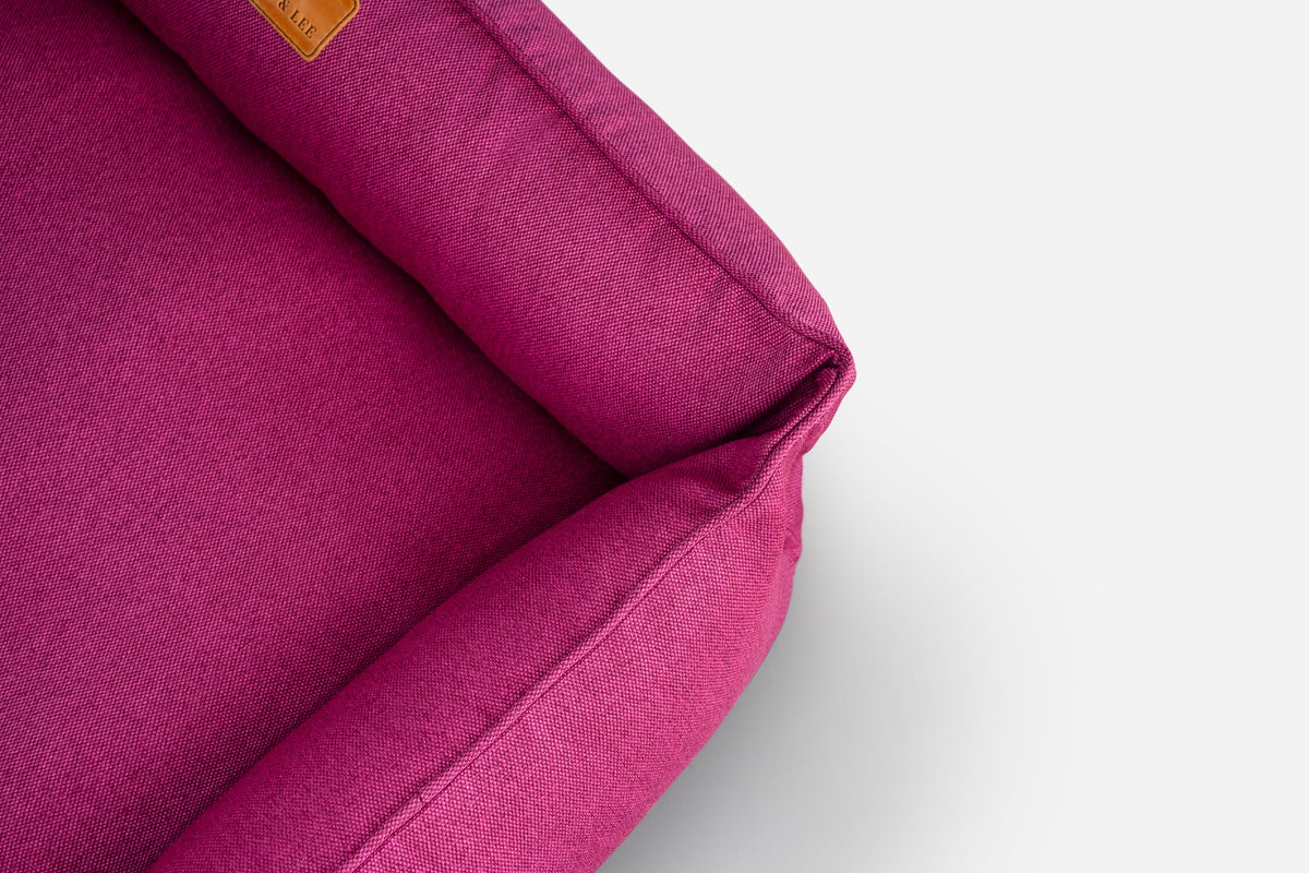 Cotton Sleeper Dog Bed - Berry Pink in use
