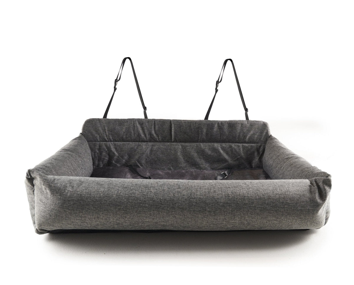 Performance tweed car bed secured with headrest straps