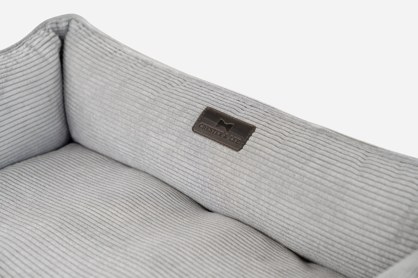 Gray ribbed fabric with a brand logo on a white background