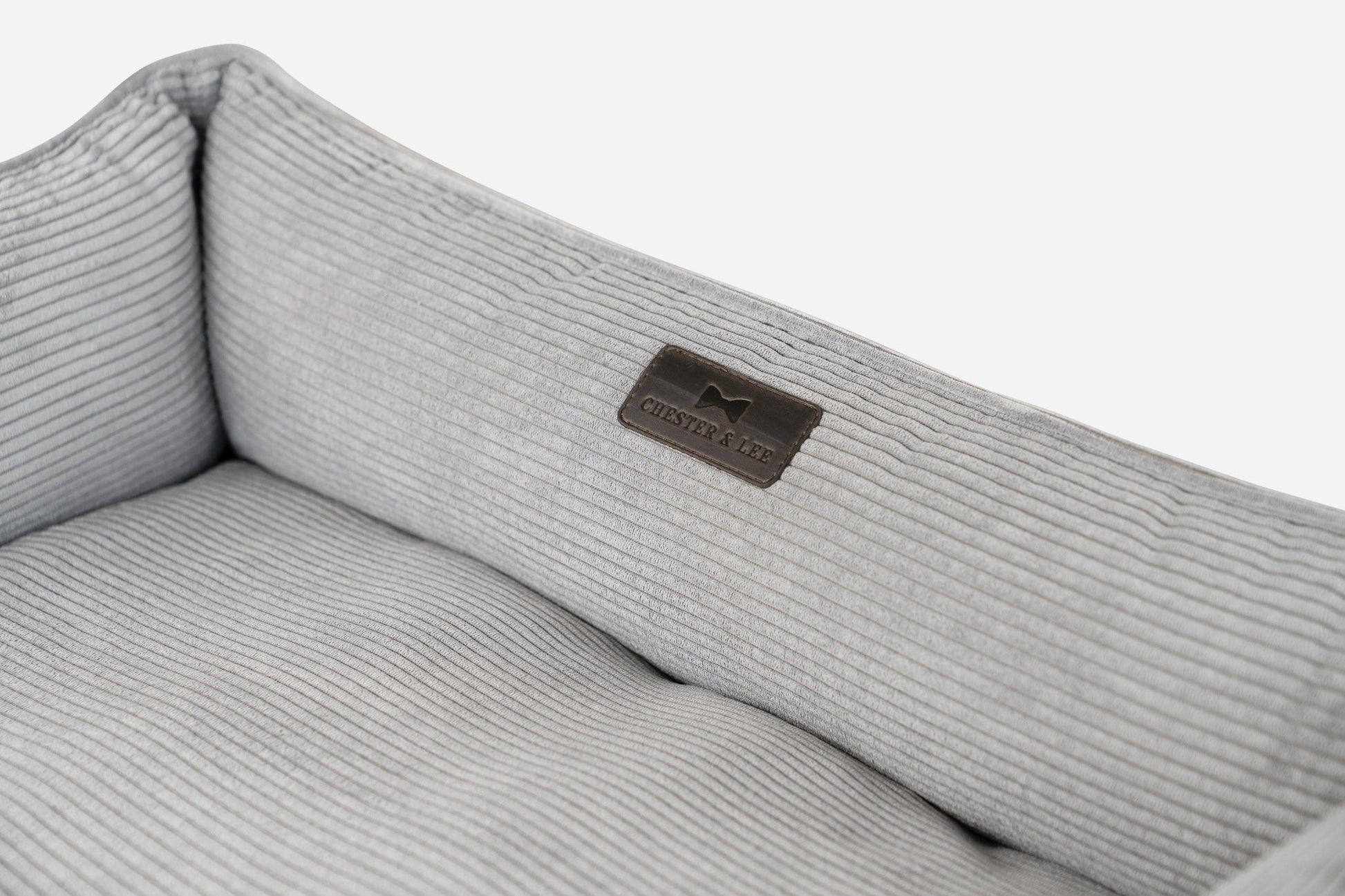 Gray ribbed fabric with a brand logo on a white background