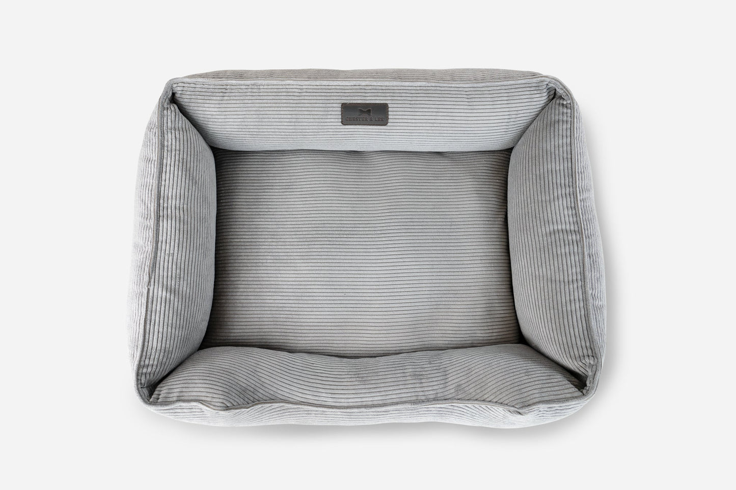 Gray pet bed with striped pattern on a white background