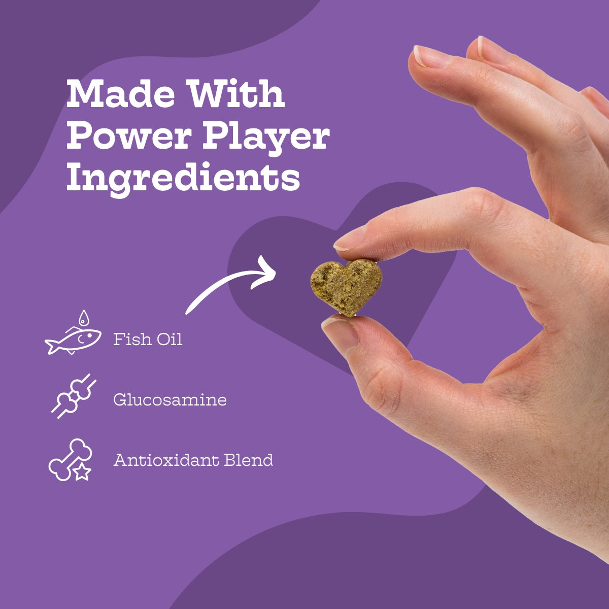 Hand holding a heart-shaped supplement with 'Made With Power Player Ingredients' text and icons on a purple background