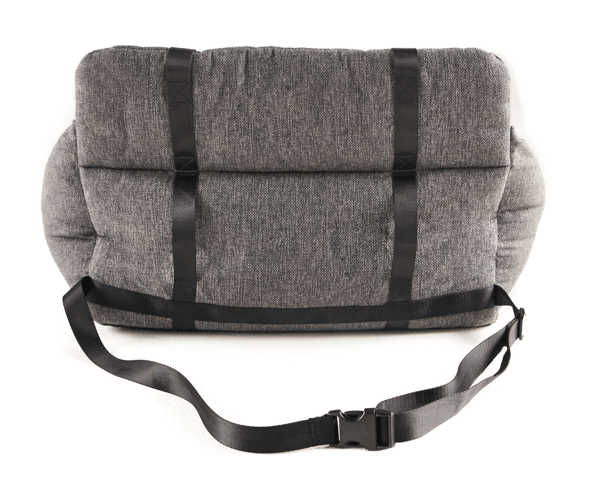 Dog in the performance tweed car bed across a back seat
