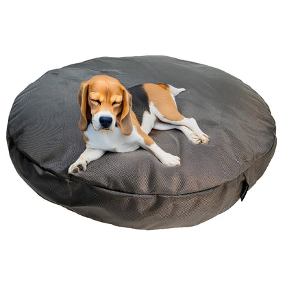 Dog resting on a gray Round Armor Dog Bed