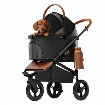 Black Furvelo Jogger pet stroller with a dachshund riding in the enclosed cabin