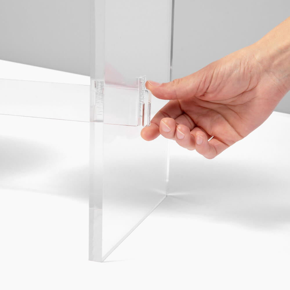 Hand removing the clear acrylic feeder leg